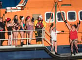 ​The intrepid swimmers get ready to take to the waters at Fraserbugh Harbour. Pic: RNLI