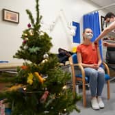 A person receives a Covid-19 vaccination as a 24-hour "jabathon" takes place at an overnight walk-in vaccine clinic at the Morris House GP practice in Haringey. Picture date: Friday December 17, 2021.