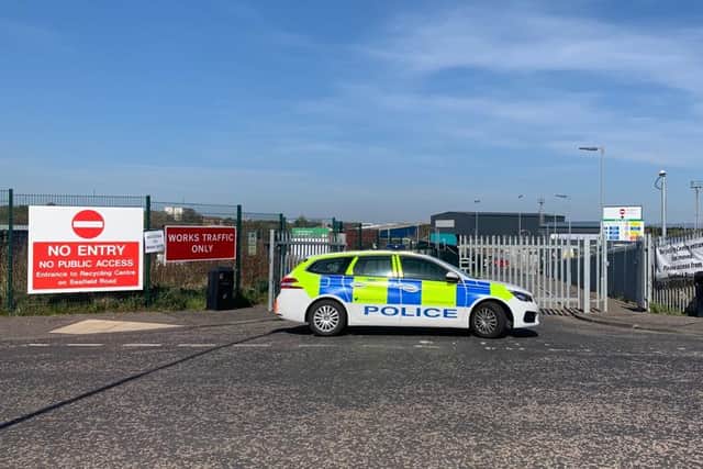 Police outside the recycling centre. Pic: Andy O'Brien