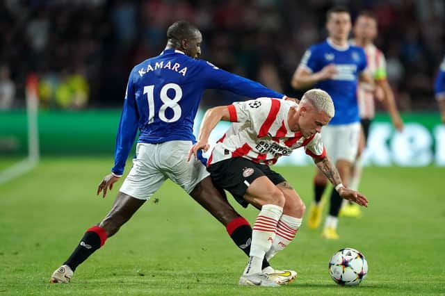 Rangers' Glen Kamara (left) and PSV Eindhoven's Philipp Max battle for the ball.