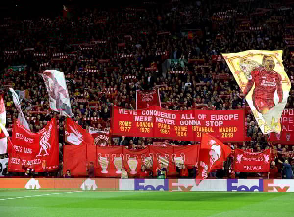 Liverpool fans show their support with flags and banners prior to the UEFA Champions League Group A match against Rangers