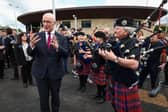 SNP leader John Swinney speaks next to some bagpipe players as he attends the official opening of the Levenmouth Rail Link. Picture: Jeff J Mitchell/Getty Images