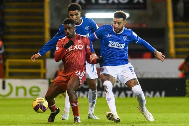 Aberdeen's Luis Lopes (L) and Rangers' Connor Goldson challenge for the ball during the previous meeting at Pittodrie in December. (Photo by Craig Foy / SNS Group)