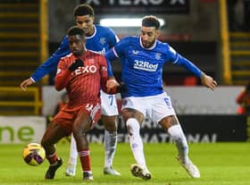 Aberdeen's Luis Lopes (L) and Rangers' Connor Goldson challenge for the ball during the previous meeting at Pittodrie in December.  (Photo by Craig Foy / SNS Group)