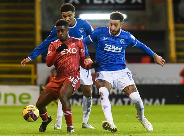 Aberdeen's Luis Lopes (L) and Rangers' Connor Goldson challenge for the ball during the previous meeting at Pittodrie in December.  (Photo by Craig Foy / SNS Group)