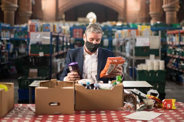 Labour leader Keir Starmer visited a food bank distribution centre in London ahead of tonight's non-binding Universal Credit vote