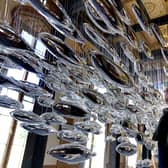 Artist Joseph Rossano views his art installation The Salmon School on display in the Castle Ballroom at the opening of Life at Balmoral, part of the Queen's Platinum Jubilee celebrations. Pic: Andrew Milligan