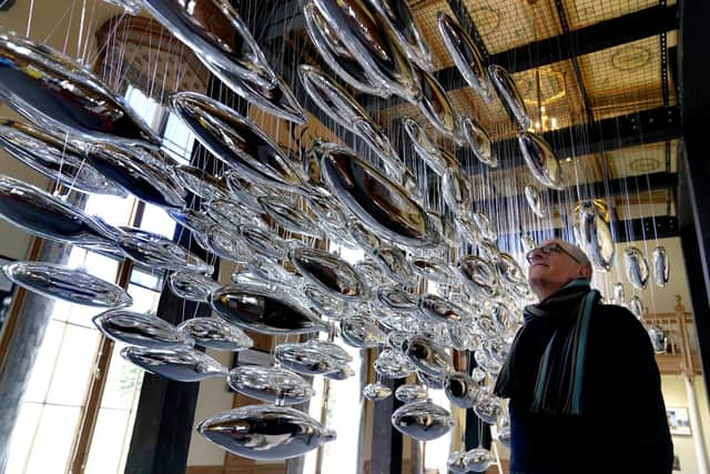 Artist Joseph Rossano views his art installation The Salmon School on display in the Castle Ballroom at the opening of Life at Balmoral, part of the Queen's Platinum Jubilee celebrations. Pic: Andrew Milligan