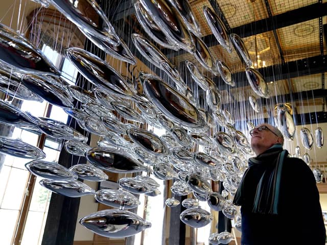 Artist Joseph Rossano views his art installation The Salmon School on display in the Castle Ballroom at the opening of Life at Balmoral, part of the Queen's Platinum Jubilee celebrations. Pic: Andrew Milligan