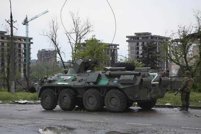 An APC of Donetsk People's Republic militia stands not far from Mariupol's besieged Azovstal steel plant, in Mariupol, in territory under the government of the Donetsk People's Republic, eastern Ukraine, Thursday, May 19, 2022. (AP Photo)