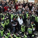 Two men are released from the back of an Immigration Enforcement van accompanied by lawyer Aamer Anwar and Mohammad Asif, director of the Afghan Human Rights Foundation, in Kenmure Street, Glasgow which is surrounded by protesters.