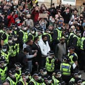 Two men are released from the back of an Immigration Enforcement van accompanied by lawyer Aamer Anwar and Mohammad Asif, director of the Afghan Human Rights Foundation, in Kenmure Street, Glasgow which is surrounded by protesters.