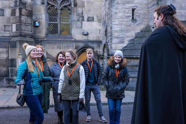 A tour guide from Mercat Tours shares stories of Edinburgh's past