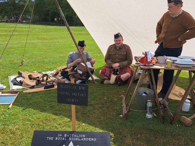 A sewing lesson with some WW! soldiers.