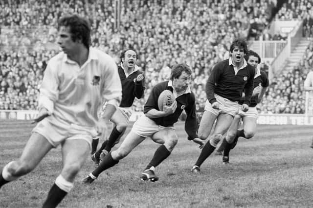 Roy Laidlaw, urged on by Jim Renwick and John Beattie, on his way to scoring in the win over England at Twickenham in 1983.