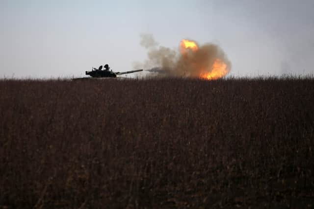 A Ukrainian tank fires toward Russian position near the town of Bakhmut, Donetsk region on January 26, 2023, amid the Russian invasion of Ukraine. (Photo by Anatolii Stepanov / AFP)