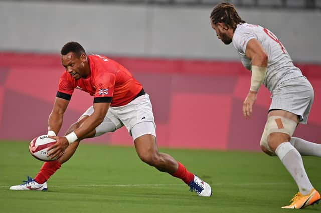 Dan Norton scores the winning try for Great Britain in the men's quarter-final rugby 7s match