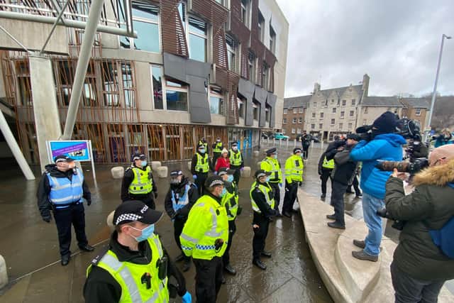 Police outside the Scottish Parliament after anti-Covid protestors were moved on.