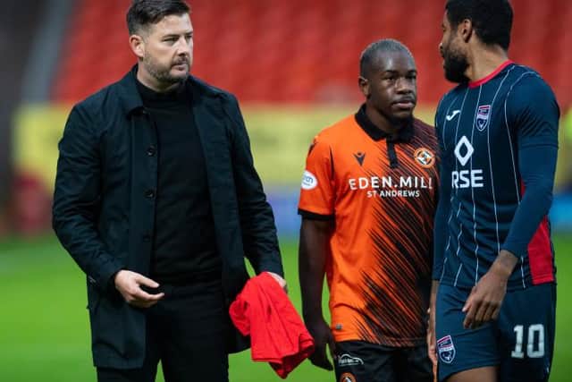 Dundee United manager Tam Courts with Jeando Fuchs and Dominic Samuel at full time. (Photo by Mark Scates / SNS Group)