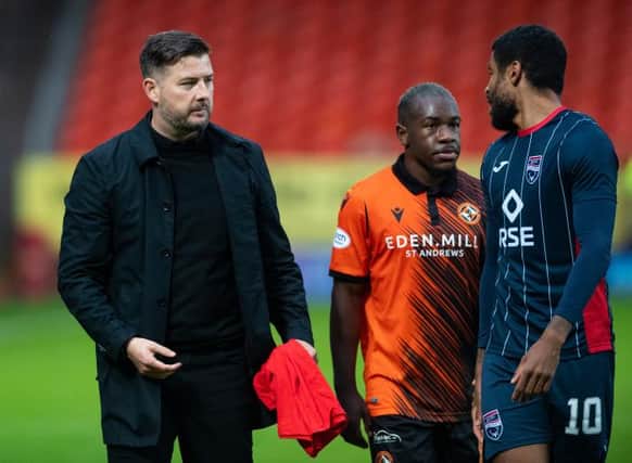 Dundee United manager Tam Courts with Jeando Fuchs and Dominic Samuel at full time. (Photo by Mark Scates / SNS Group)