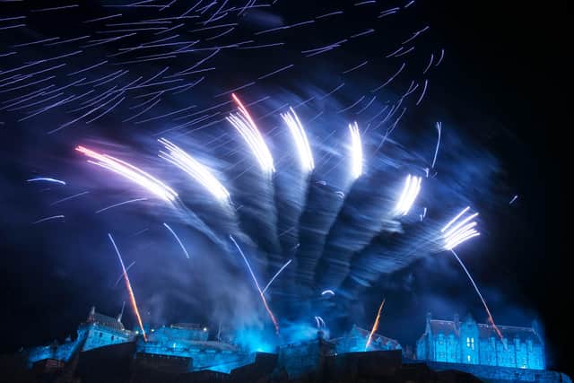 Fireworks light up the sky above Edinburgh Castle as part of Hogmanay celebrations in 2015. Picture: Ross Gilmore