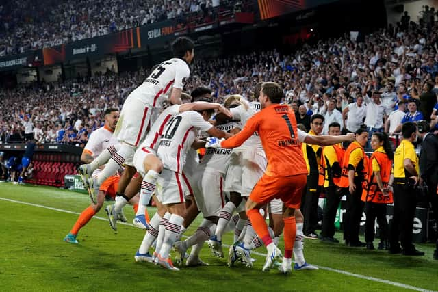 Eintracht Frankfurt players celebrate victory following the penalty shoot-out victory.