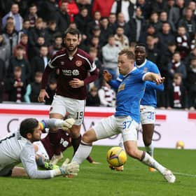 Hearts keeper Craig Gordon makes a save from Scott Arfield.