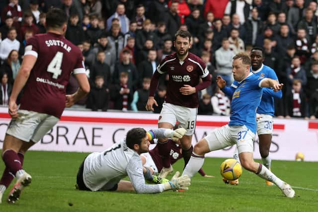 Hearts keeper Craig Gordon makes a save from Scott Arfield.