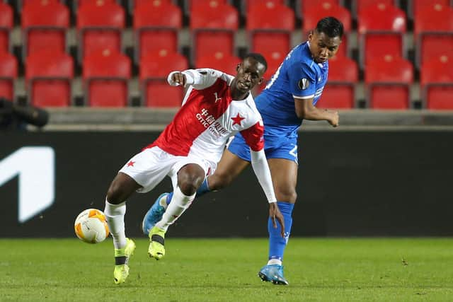 Rangers striker Alfredo Morelos battles with Slavia Prague's Abdallah Sima during the Europa League round of 16 first leg match. (Photo by MILAN KAMMERMAYER/AFP via Getty Images)