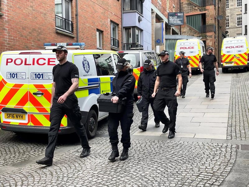There are four police vans and at around five unmarked police cars outside the Jackson’s Entry building, of which the party headquarters is on the third floor.