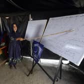 Flood affected children attend makeshift school organized by Islamic group Jamaat-e-Islami Pakistan, in Sukkur, Pakista. (AP Photo/Fareed Khan, File)