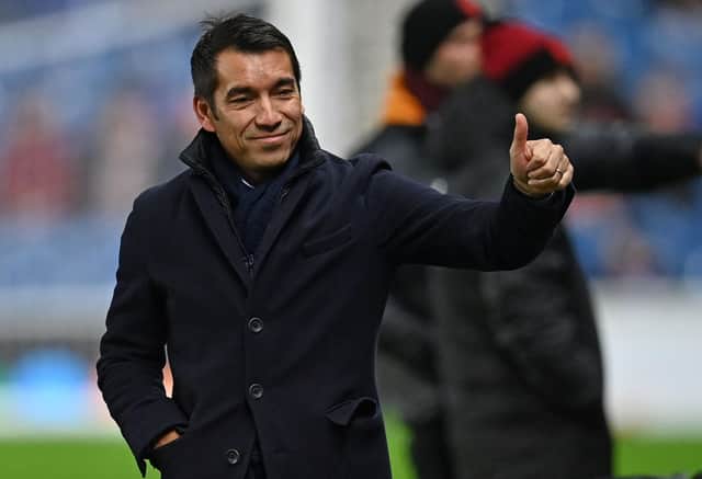 Rangers' Dutch manager Giovanni van Bronckhorst makes a thumbs up gesture to the fans ahead of the UEFA Europa League Group A football match between Rangers and Sparta Prague at the Ibrox Stadium in Glasgow on November 25, 2021. (Photo by Paul ELLIS / POOL / AFP) (Photo by PAUL ELLIS/POOL/AFP via Getty Images)