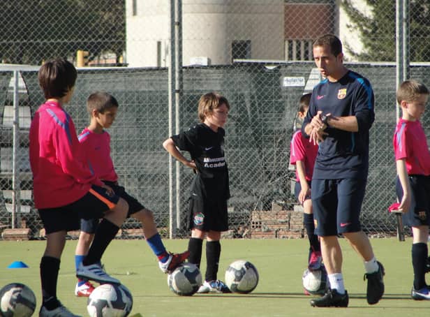 An eight-year-old Archie Meekison, centre in black, training with Barcelona in the shadow of Camp Nou.