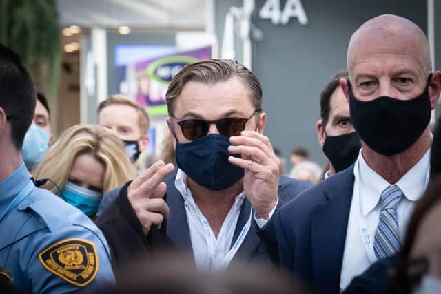 Leonardo DiCaprio who starred in 1988's The Man in the Iron Mask, wore a different style of face cover as he attended COP26.