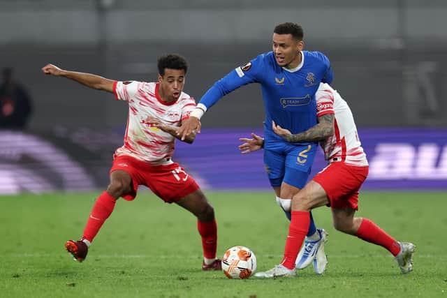 LEIPZIG, GERMANY - APRIL 28: James Tavernier of Rangers is challenged by Tyler Adams and Angelino of RB Leipzig during the UEFA Europa League Semi Final Leg One match between RB Leipzig and Rangers at Football Arena Leipzig on April 28, 2022 in Leipzig, Germany. (Photo by Maja Hitij/Getty Images)