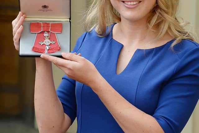 Lily Owsley with her MBE at an investiture ceremony at Buckingham Palace following Team GB's Olympic success in Rio.