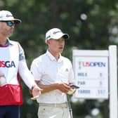 Collin Morikawa talks with caddie Jonathan Jakovac on the ninth tee during the second round of the 122nd US Open at The Country Club in Brookline. Picture: Warren Little/Getty Images.