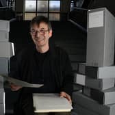 Scottish crime writer Ian Rankin, holding his 1984 manuscript for his first published novel Flood, with some of the 50 boxes of his own personal archive which he is donating to the National Library of Scotland, Edinburgh (SWNS)