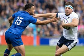 Scotland's Hamish Watson and France's Brice Dulin during the match at Murrayfield.