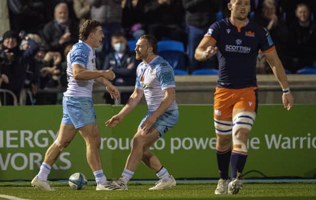 Glasgow's Josh McKay (L) celebrates scoring a try with Tom Gordon during a United Rugby Championship match between Glasgow Warriors and Edinburgh Rugby at Scotstoun Stadium, on March 18, 2022, in Glasgow, Scotland.  (Photo by Ross MacDonald / SNS Group)