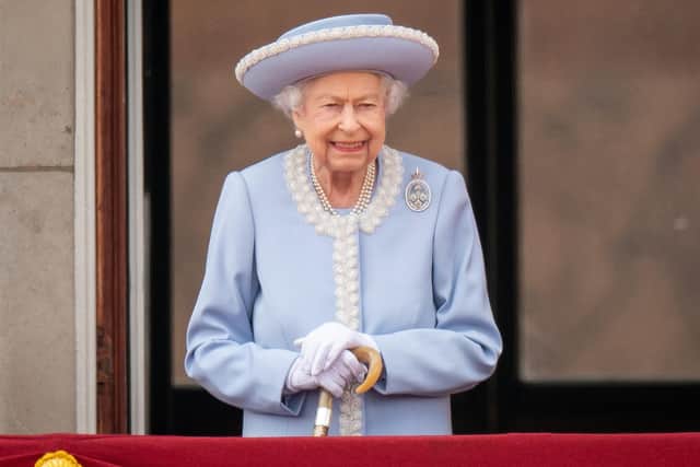 Queen Elizabeth II watches the Trooping The Colour ceremony from the balcony at Buckingham Palace on Thursday.