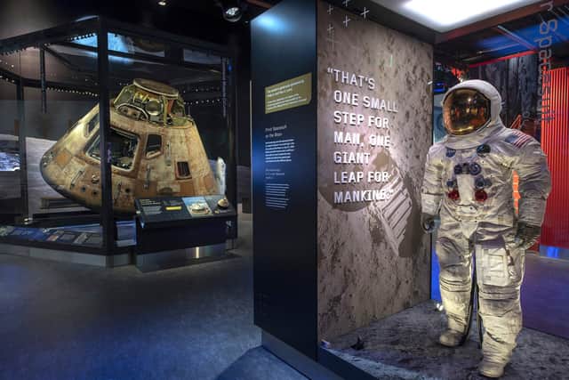 The Columbia command module and Neil Armstrong's lunar suit in the National Air and Space Museum. Pic: PA Photo/National Air And Space Museum.