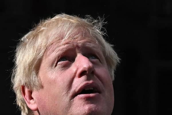 Britain's then prime minister Boris Johnson looks up as he delivers a speech in front of 10 Downing Street in central London. Picture: Ben Stansall/AFP via Getty Images