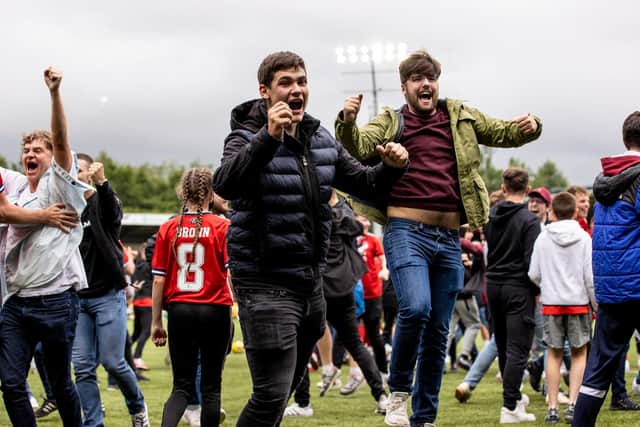 Aberdeen fans invade the pitch after Jack MacKenzie's late winner clinched a 2-1 victory at Livingston (Photo by Alan Harvey / SNS Group)