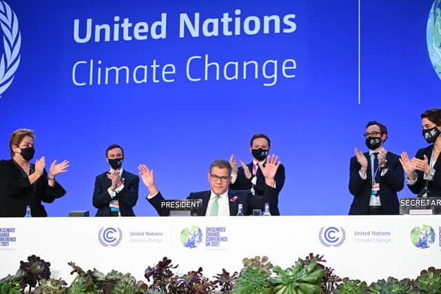 COP26 president Alok Sharma attempts to stop applause for his efforts as the summit ended amid what he called 'deep disappointment' (Picture: Jeff J Mitchell/Getty Images)