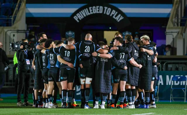 Glasgow Warriors in their post-match huddle following the win over Dragons. (Photo by Craig Williamson / SNS Group)