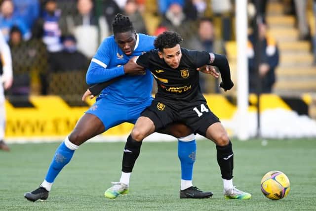 Calvin Bassey (left), pictured tussling with Livingston's Odin Bailey, has impressed new Rangers manager Giovanni van Bronckhorst with his recent displays in central defence.(Photo by Rob Casey / SNS Group)