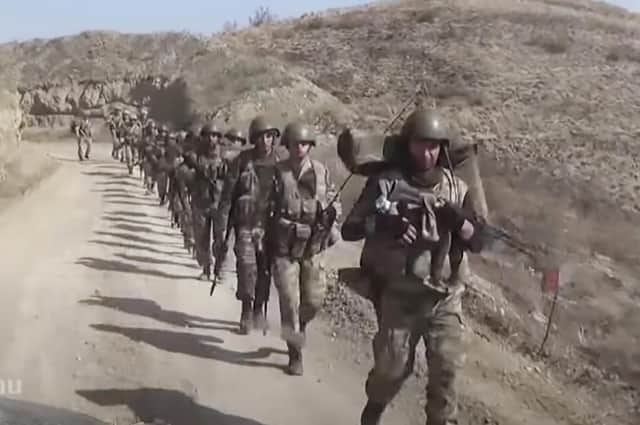 Azerbaijan's solders walk in a formation in the separatist region of Nagorno-Karabakh. Picture: Azerbaijan's DefenCe Ministry/AP
