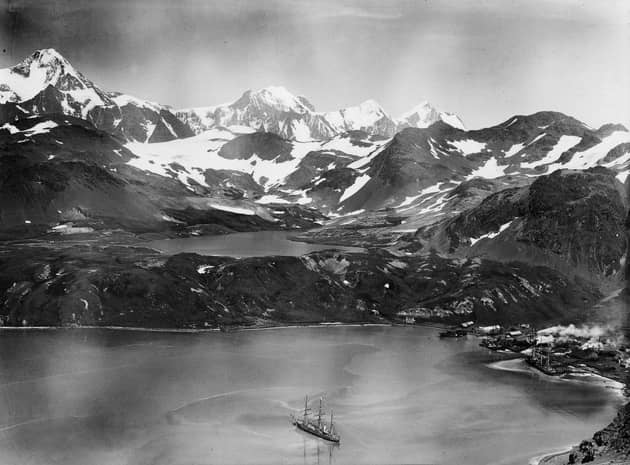 King Edward Cove and resevoir from the slopes of Mount Duse, with RRS Discovery in the foreground, in South Georgia in 1925.