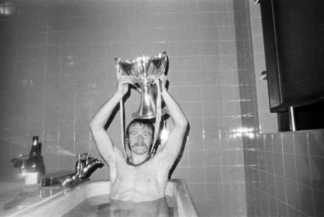 Pele's pal Davie Robb celebrates Aberdeen's League Cup final win over Celtic in the bath with a bottle of bubbly. Picture: Allan Milligan